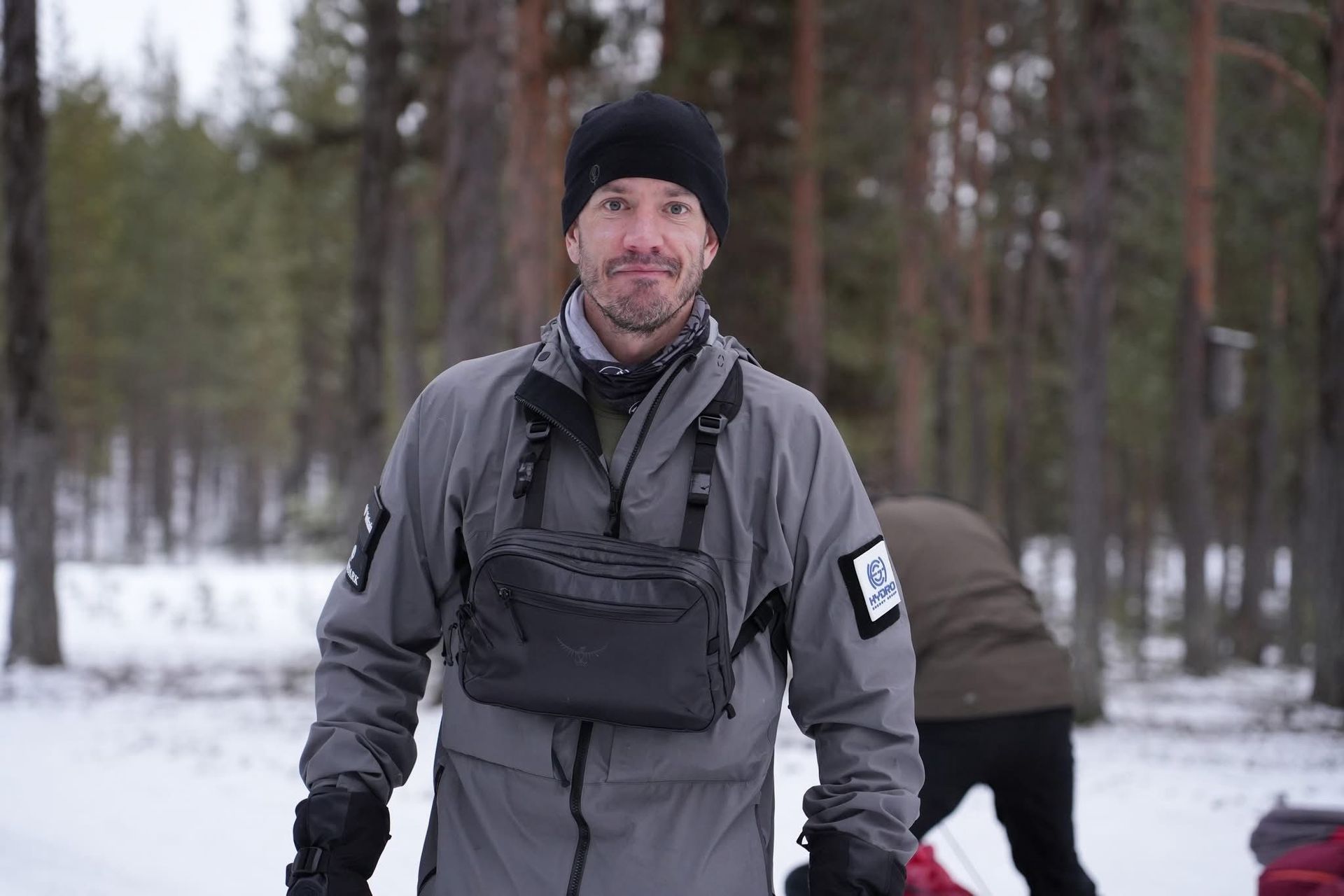 A man in a military uniform is holding a medal