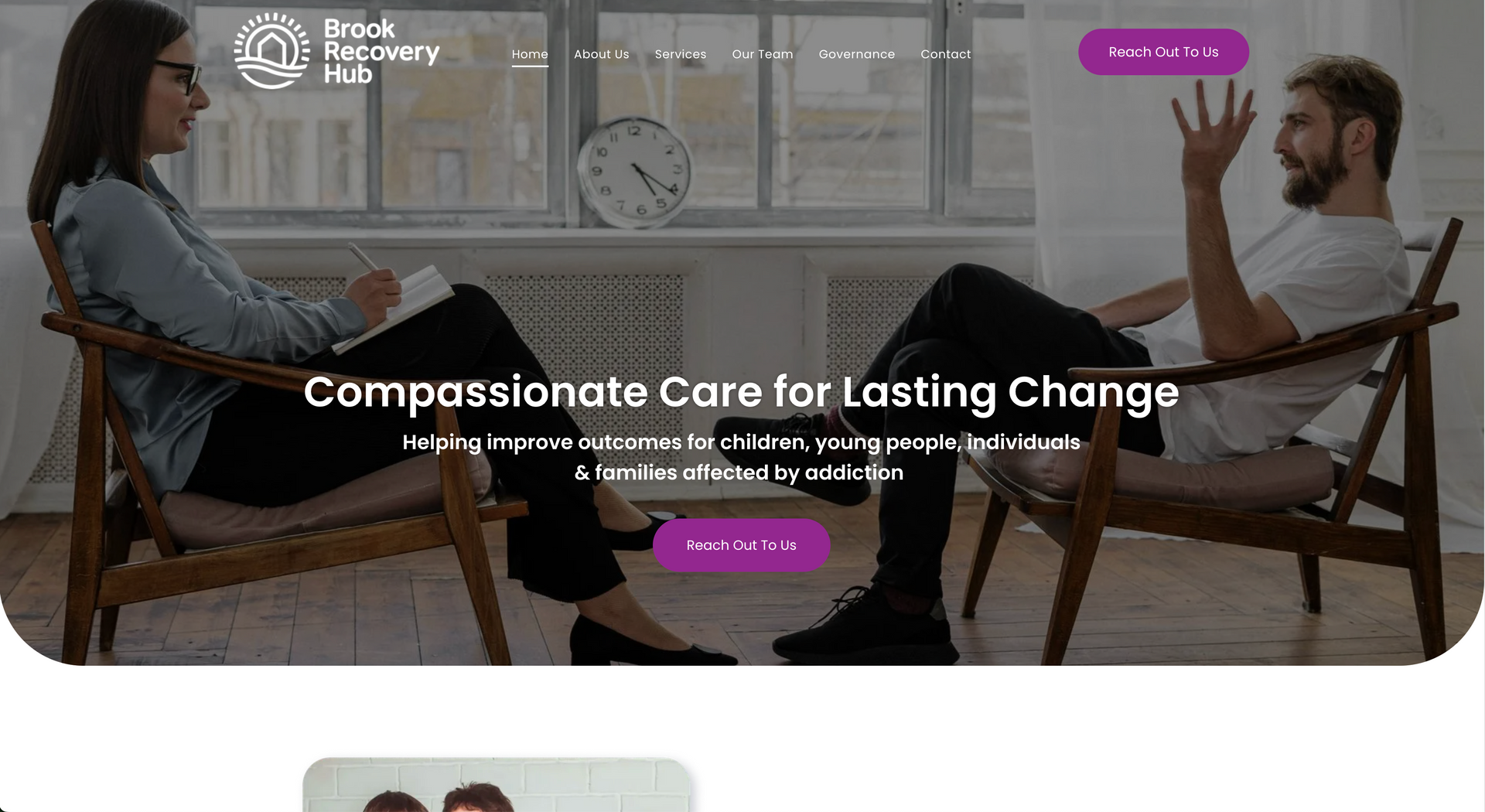 Woman and man in counseling session, seated in chairs, writing, talking.