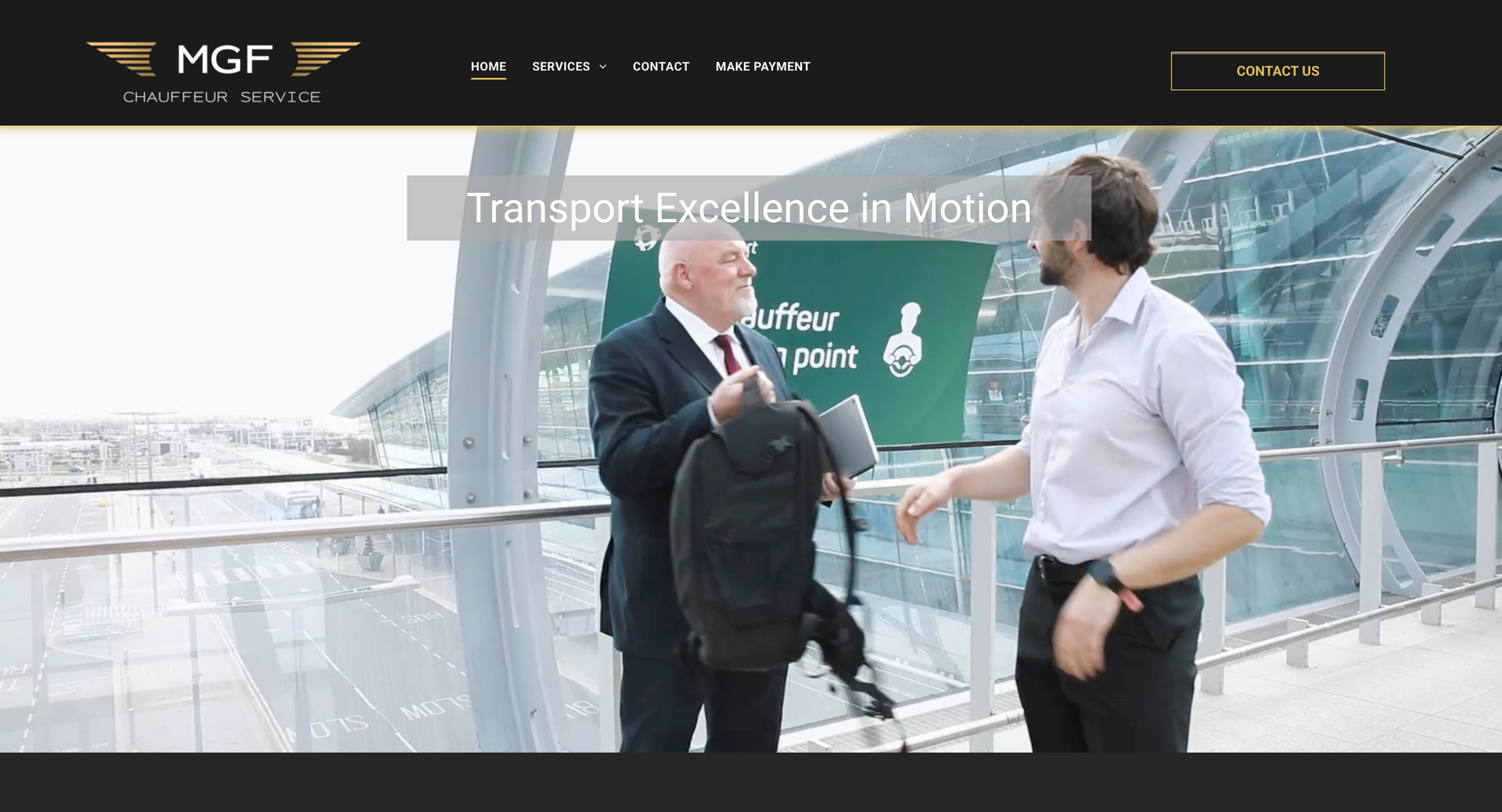 Man in suit handing bag to another man at an airport terminal. 
