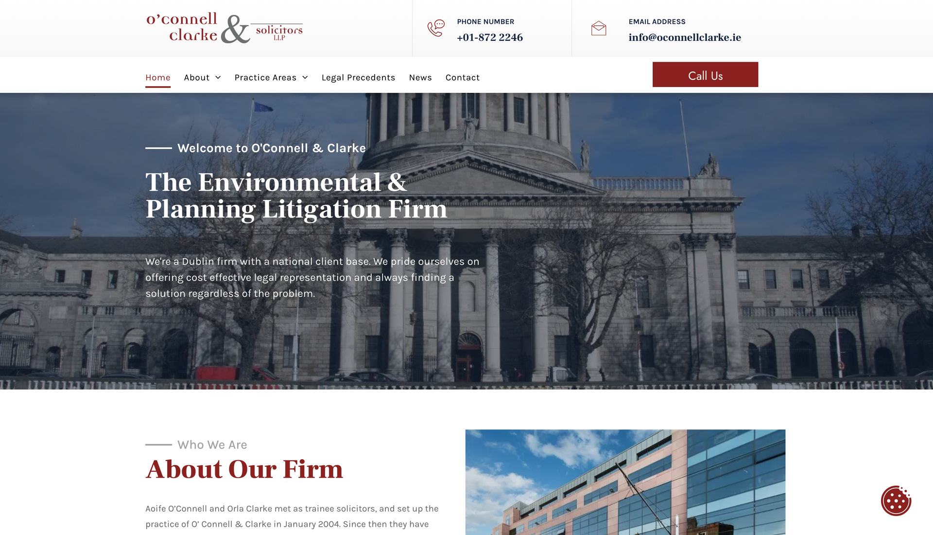 Website homepage featuring a building, firm logo, and navigation menu.