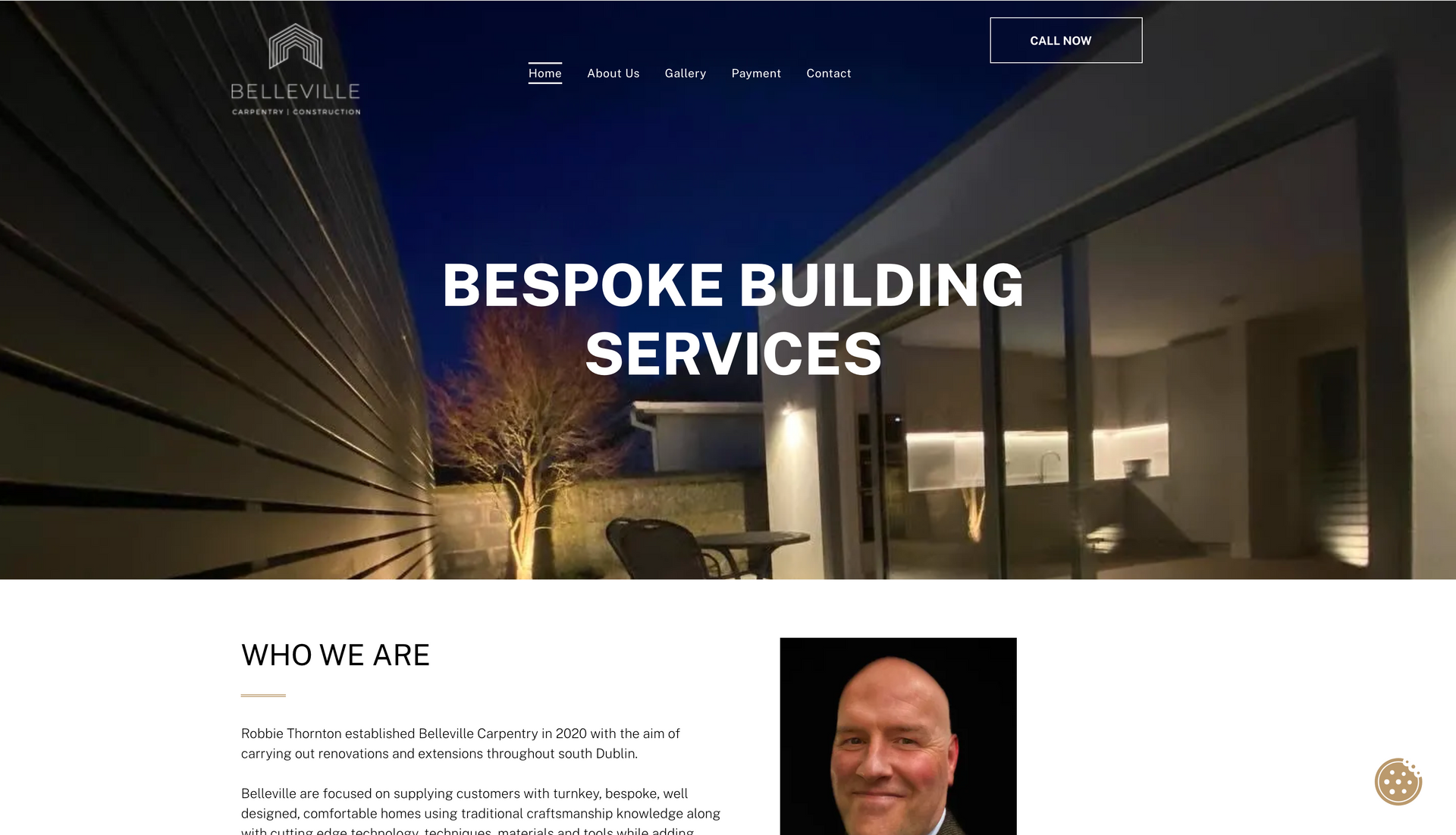 Website homepage with night exterior of a modern building, text 