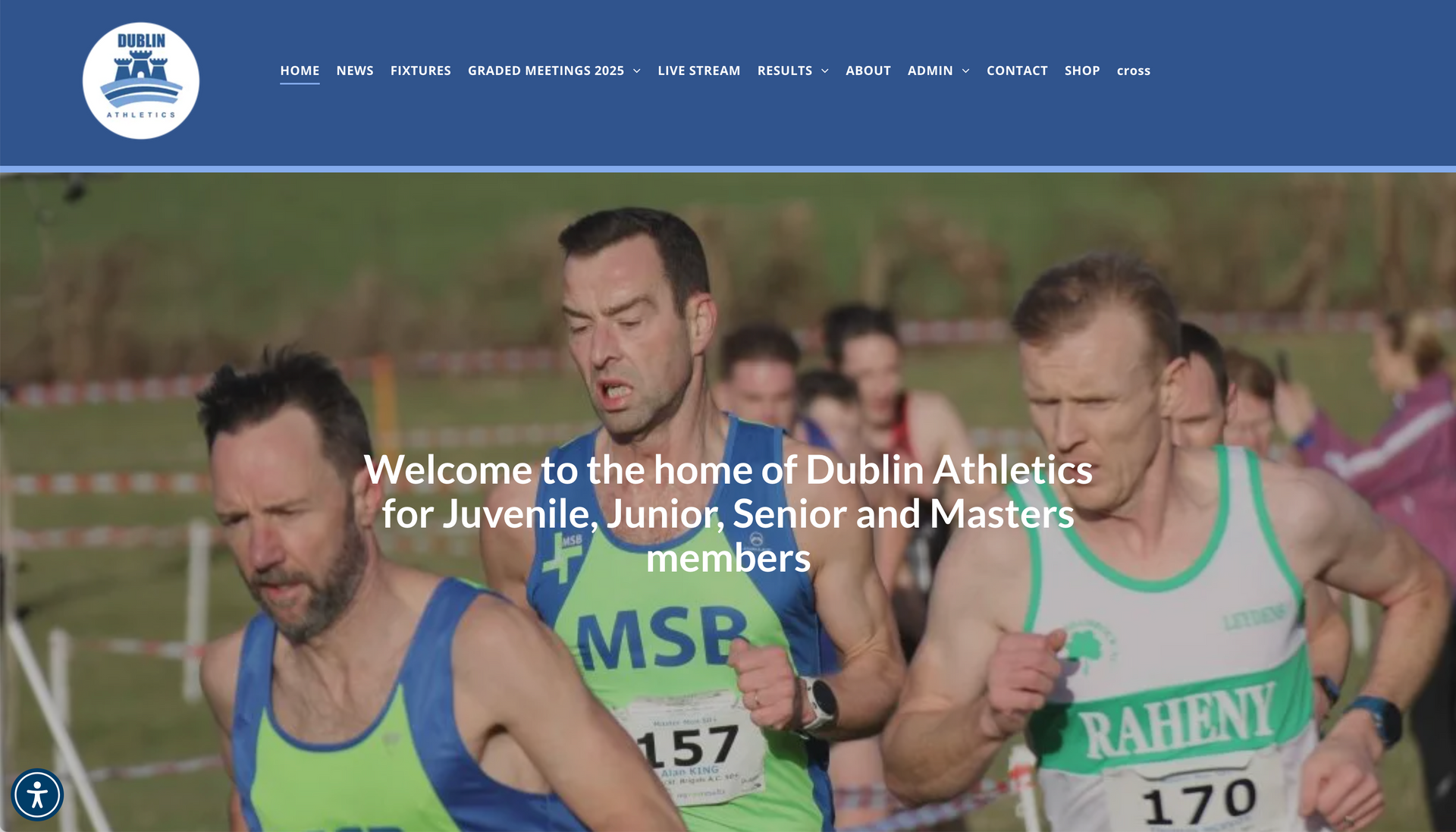 Runners in a cross-country race. The lead runner wears a green singlet with 