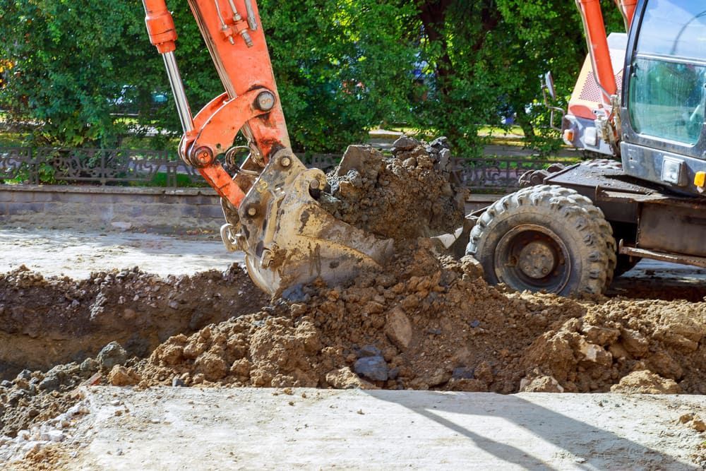The Excavator Is Working Excavation Site Construction — Bustin' Free Earthworks in Bathurst, NSW