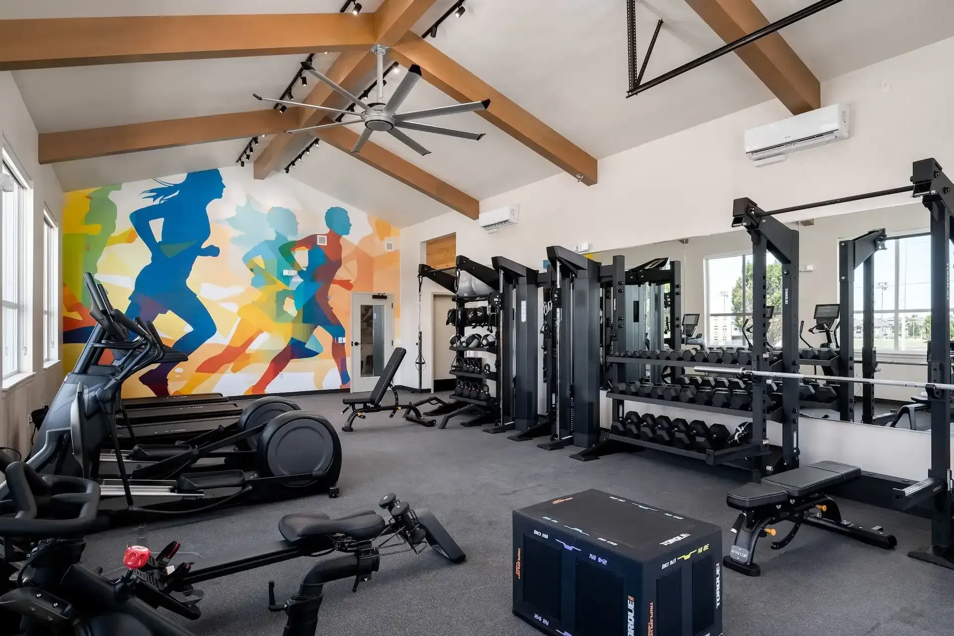 Fitness center with Peloton bikes and an open-air gate