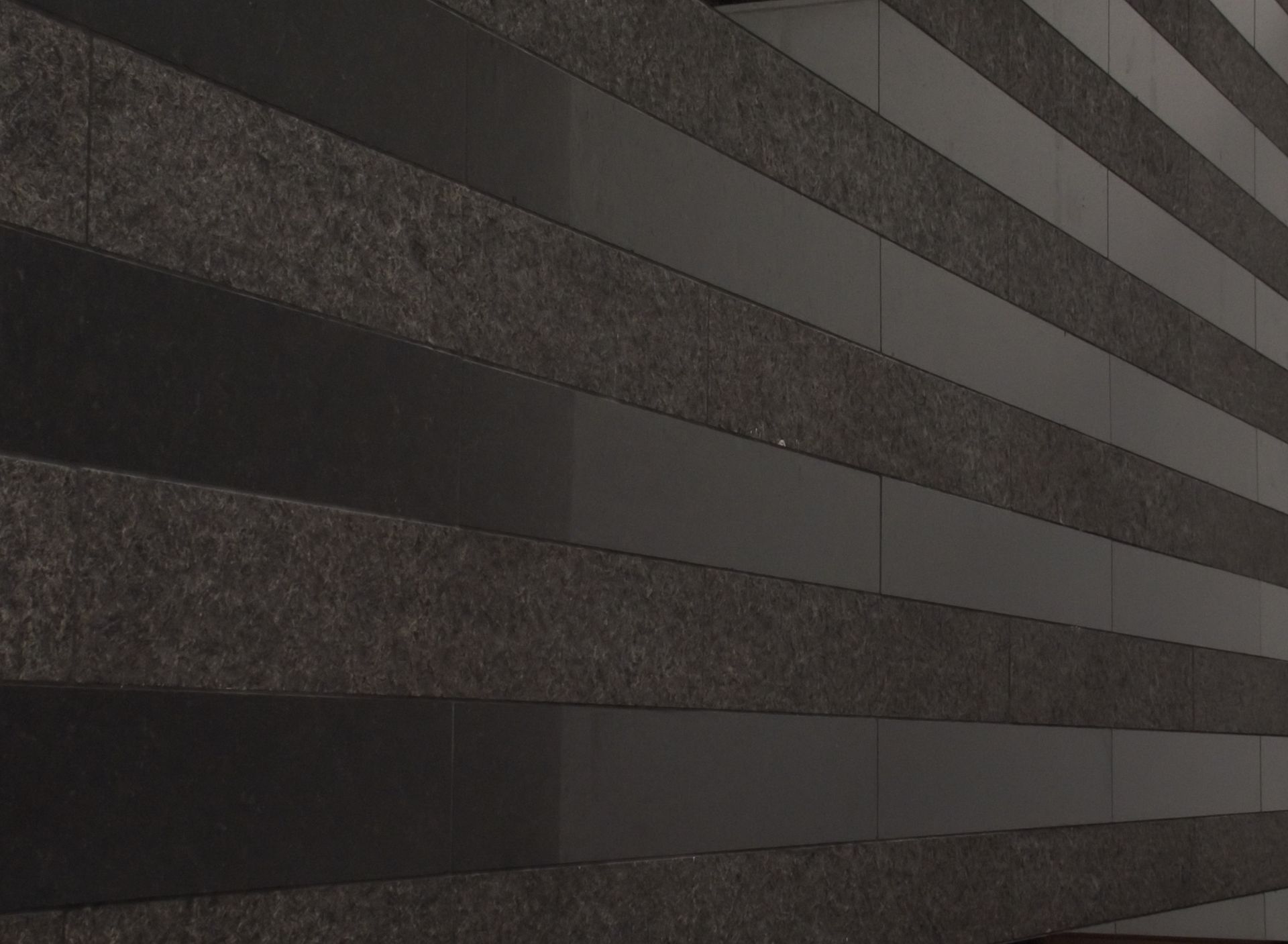 A close up of a black and white striped wall.