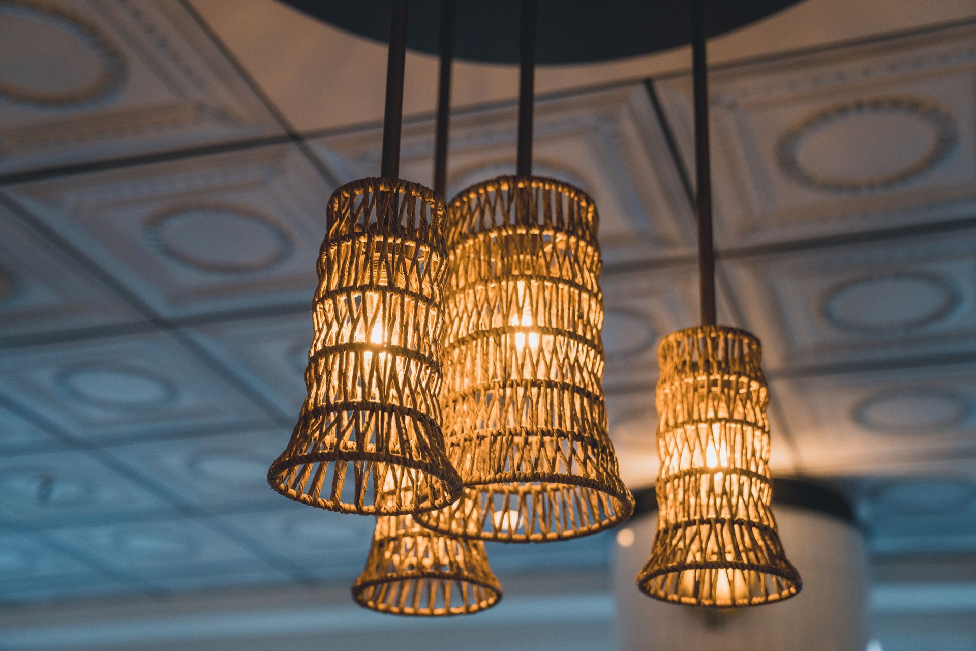A group of pendant lights hanging from a ceiling