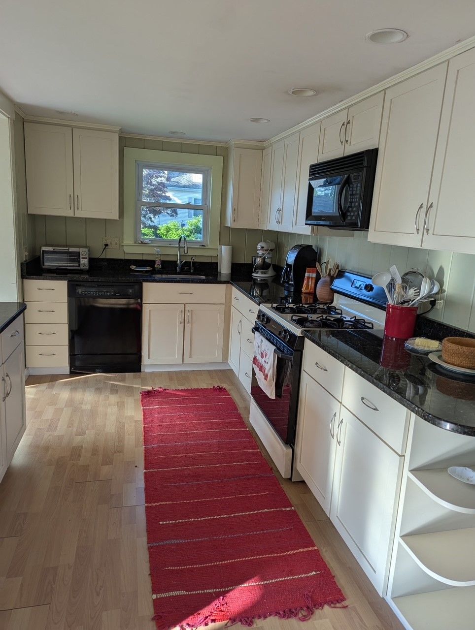 Kitchen with dishwasher, oven, microwave in a vacation rental in Wells, Maine