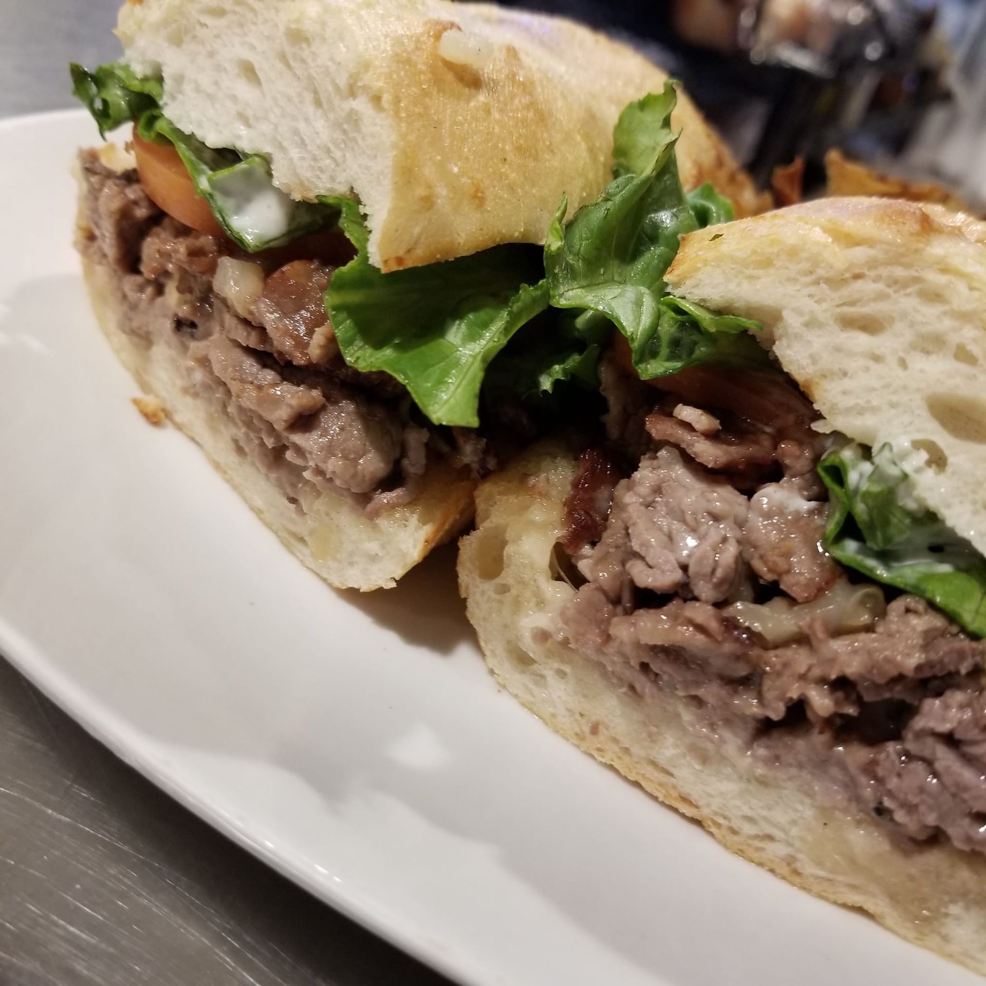 A close up of a sandwich on a white plate