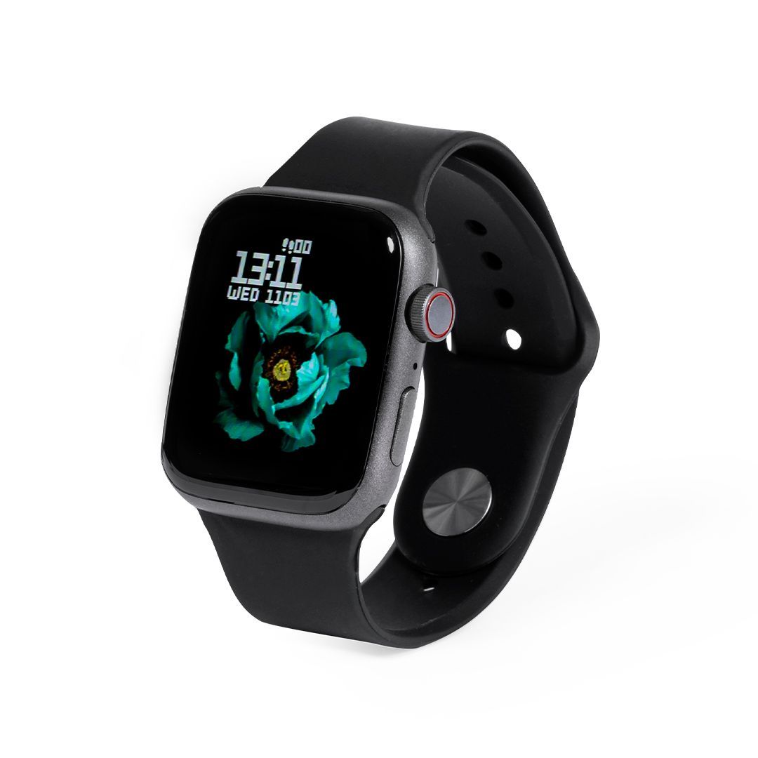 Un reloj inteligente negro con caja gris y esfera digital que muestra una flor azul sobre fondo blanco.