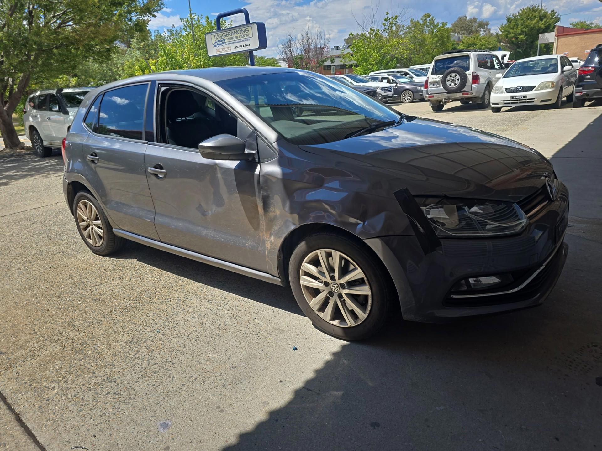 A Volkswagen Polo is parked in a parking lot — Southside Bodyworks in Greenway, ACT