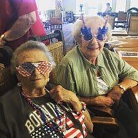 Elderly people having a fun time at an event organized by Timberhill Villa