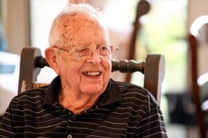 old man enjoying  time at  Timberhill Villa