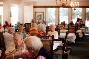 Elderly people having a fun time at  Timberhill Villa