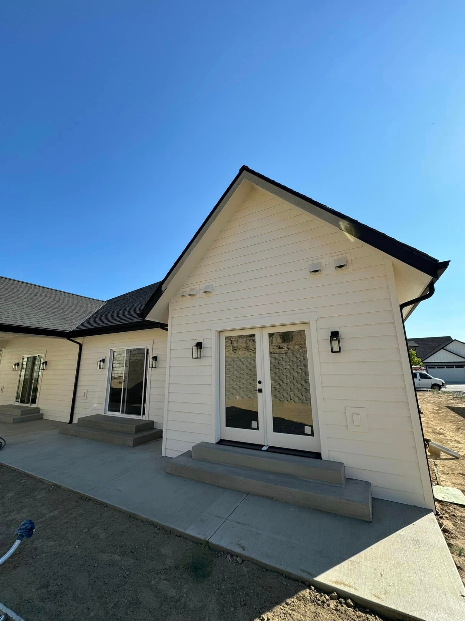 A white house with a blue sky in the background.