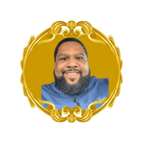 a man with a beard is smiling in a gold frame .