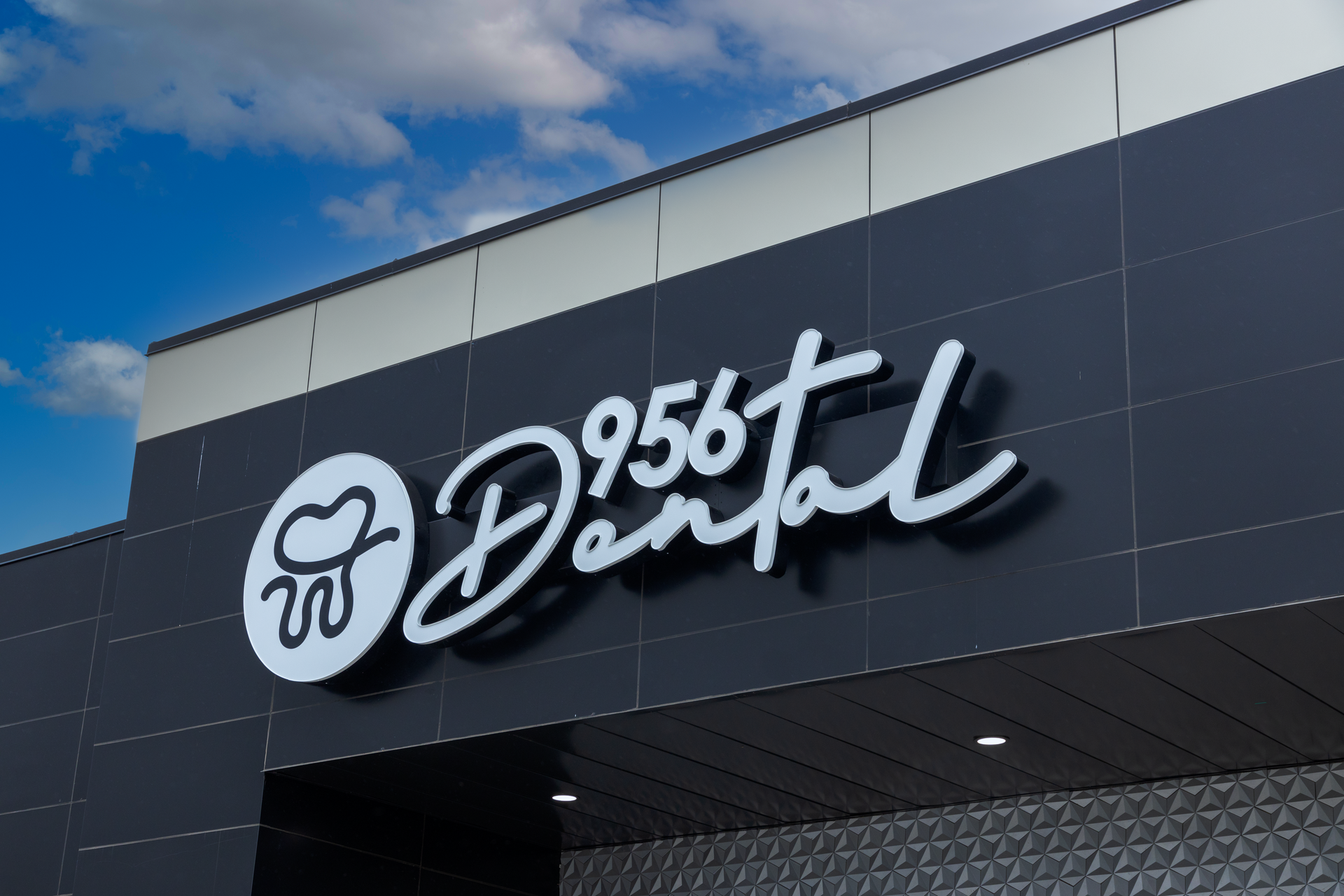 The  storefront sign 956 Dental, a dentist office located in Laredo, Texas.  