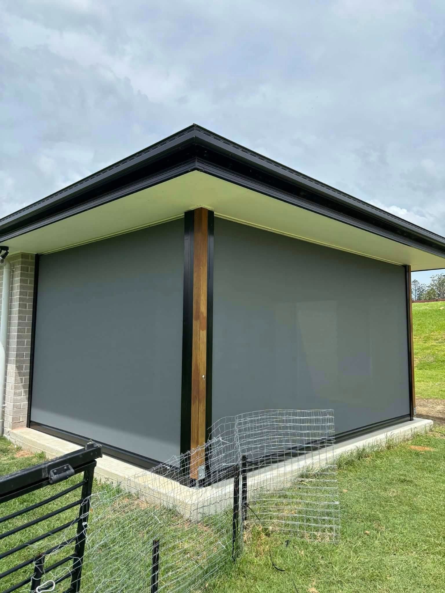 Modern House Extension With Gray Outdoor Blinds
