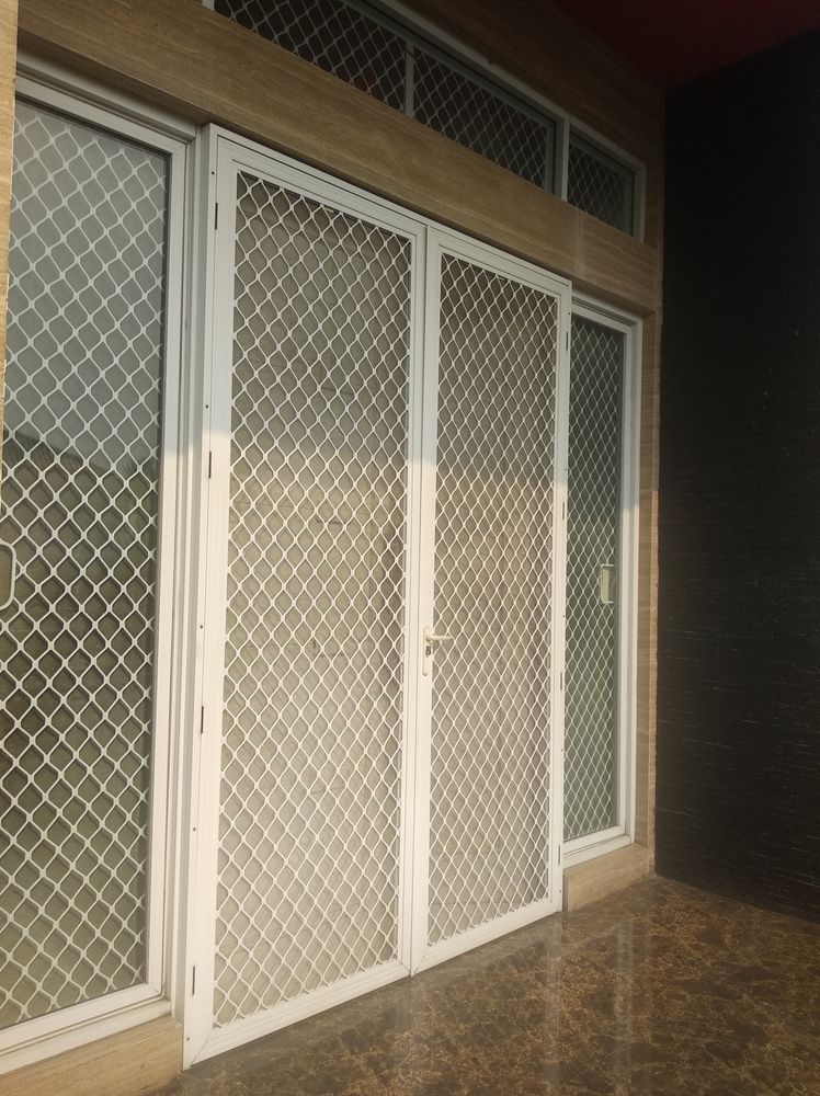 White Security Screen On The Door Entrance