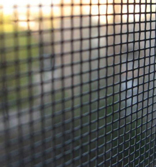 A Close Up of a Screen Door With a Blurry Background — Budget Screens & Awnings in South Lismore, NSW
