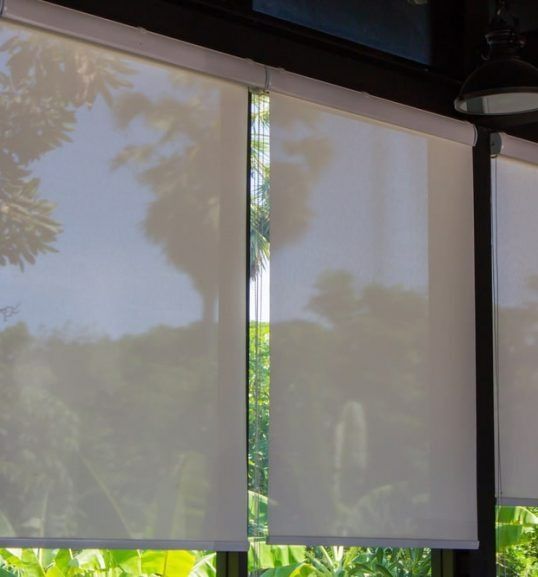 A Close Up of a Window With Roller Blinds on It — Budget Screens & Awnings in South Lismore, NSW