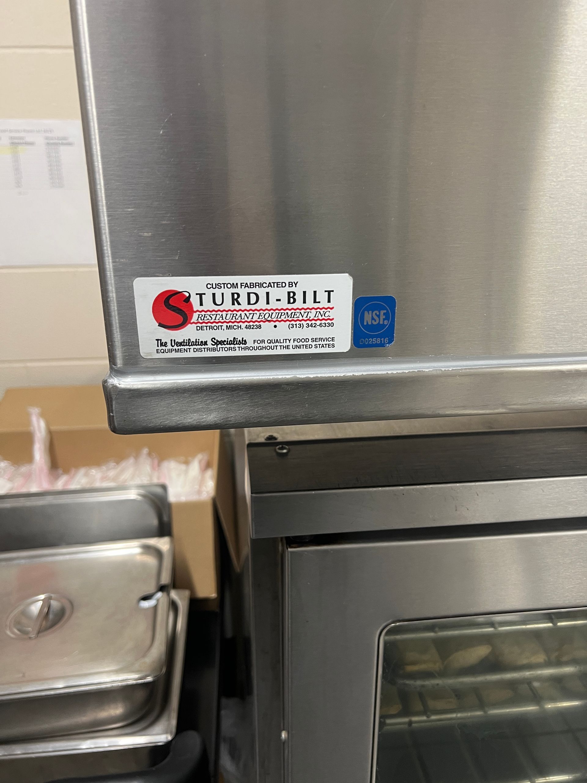 Stainless steel oven with a label that reads