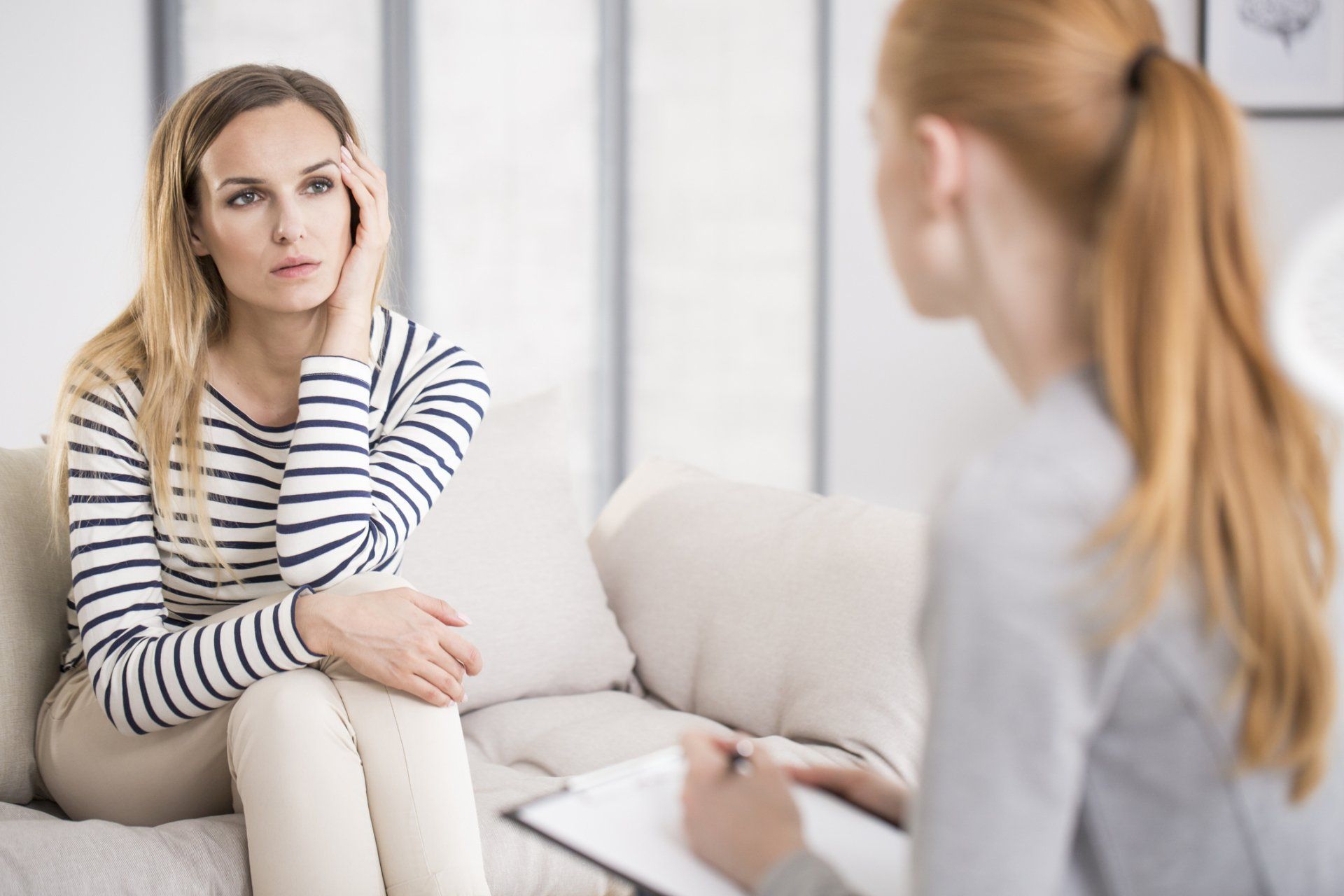 counselor sitting across from and talking with client