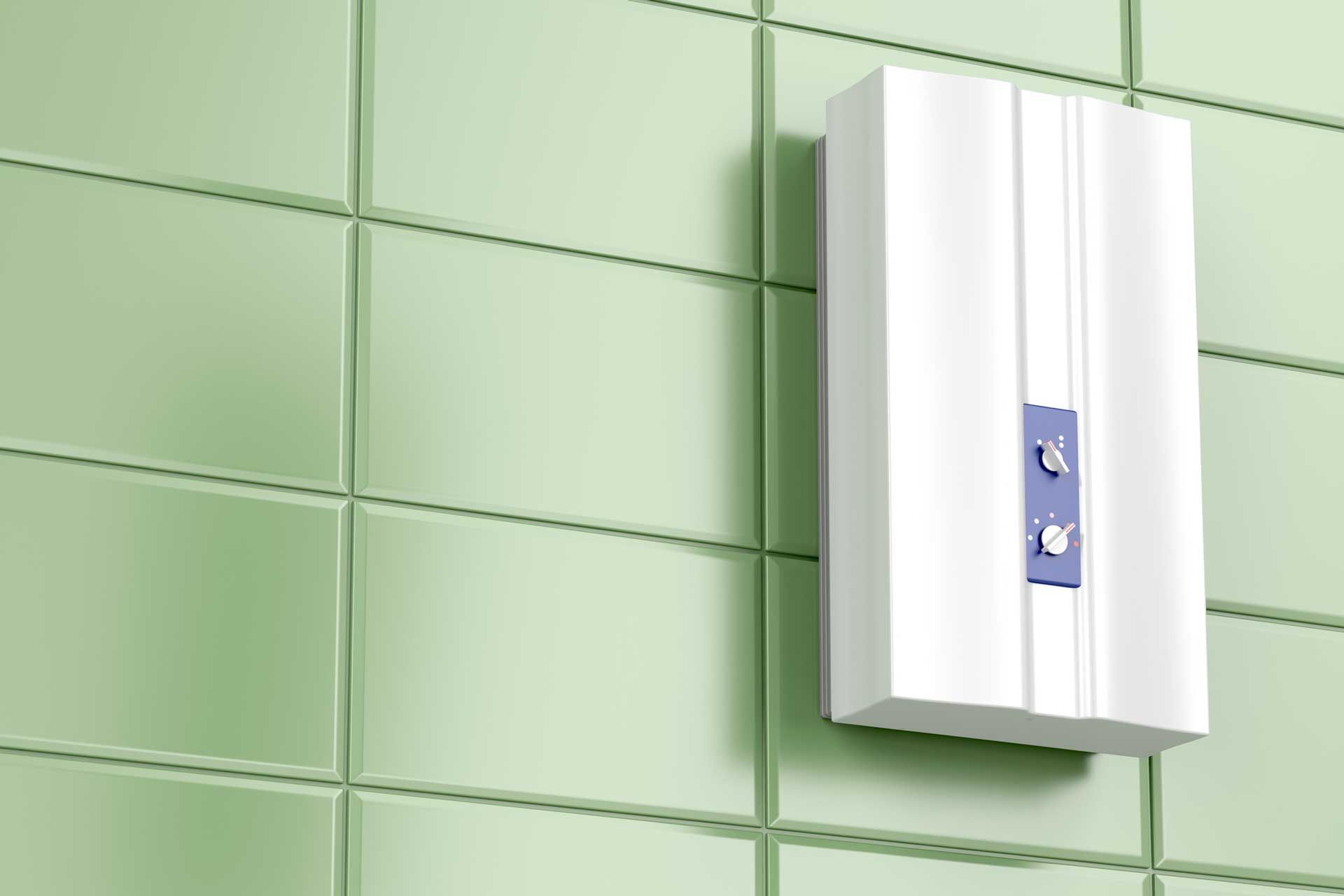 White electric water heater mounted on green tiled wall.