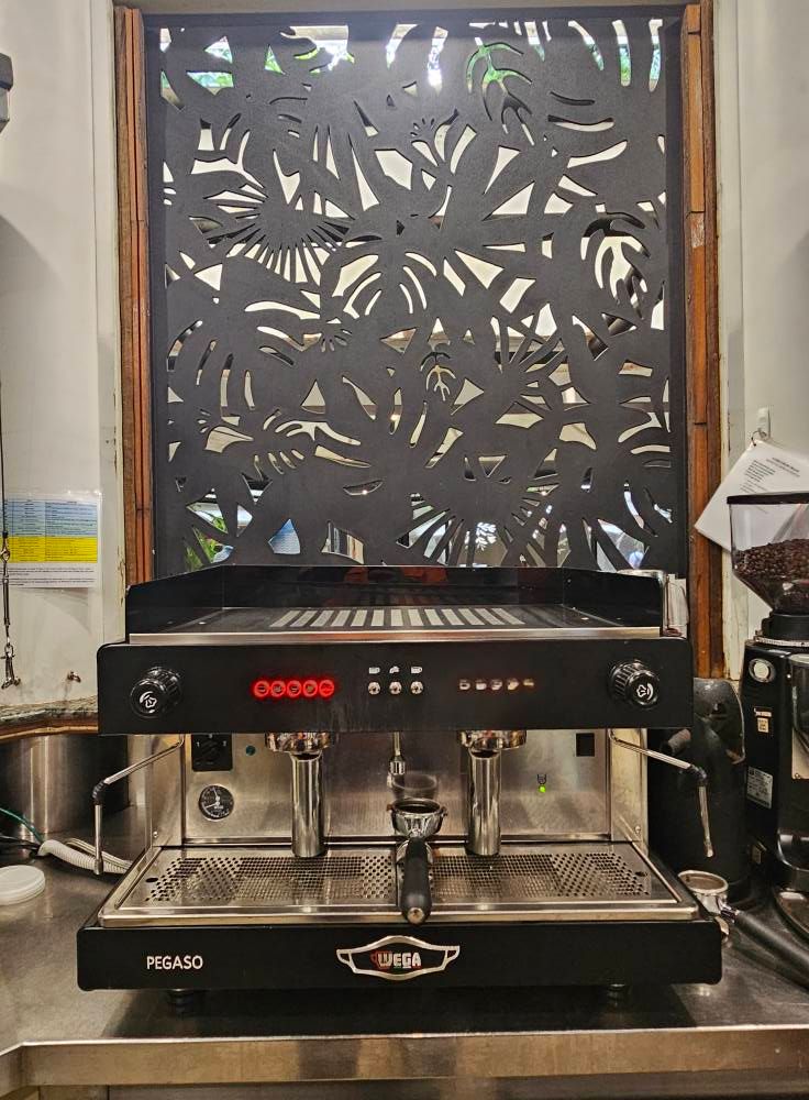 Espresso Machine Dispensing Coffee Into a Cup — Projected Contracting Electrical Services In Portsmith, QLD