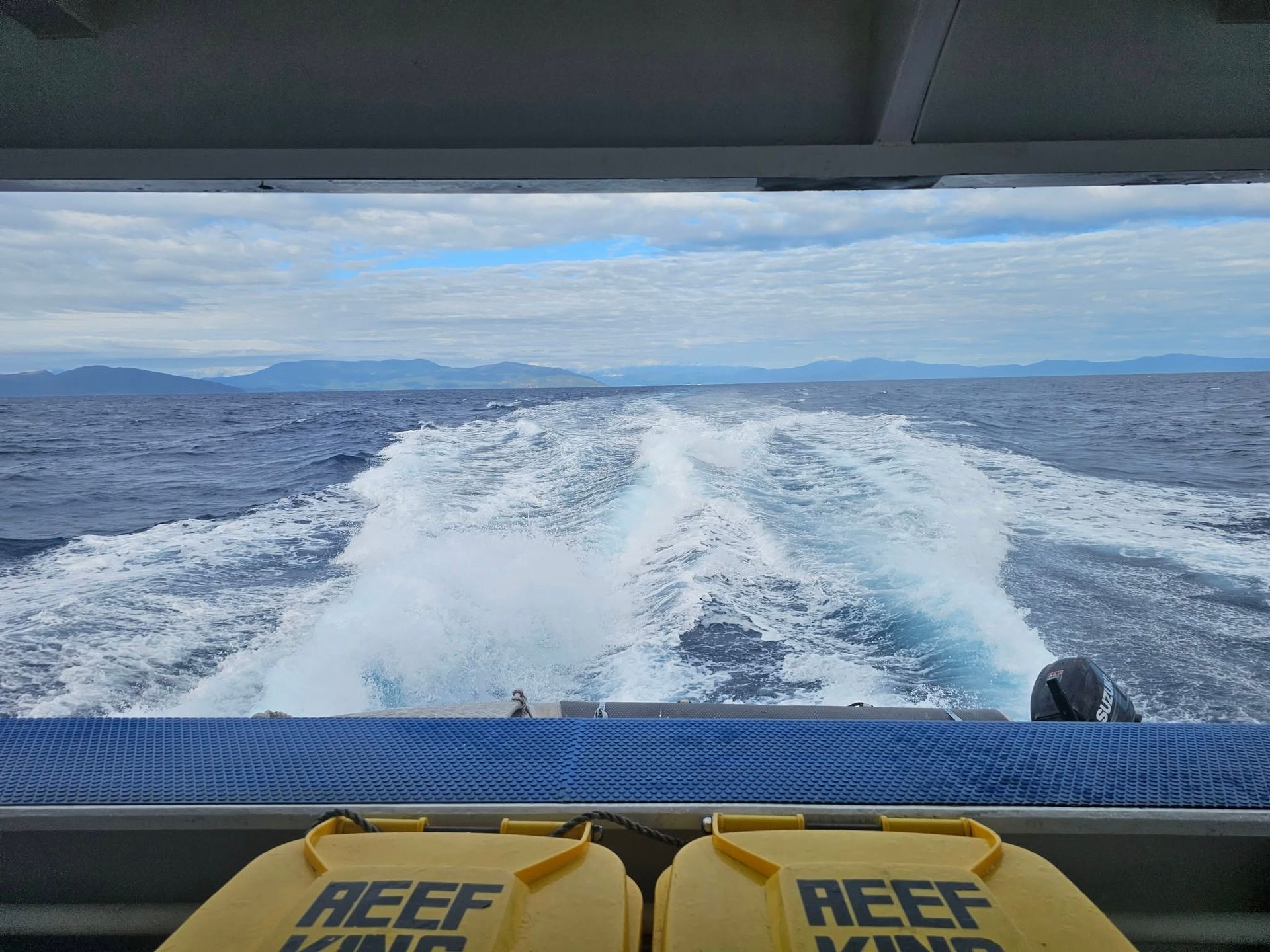 Man in Blue Coveralls Tests Electrical Equipment — Projected Contracting Electrical Services In Portsmith, QLD