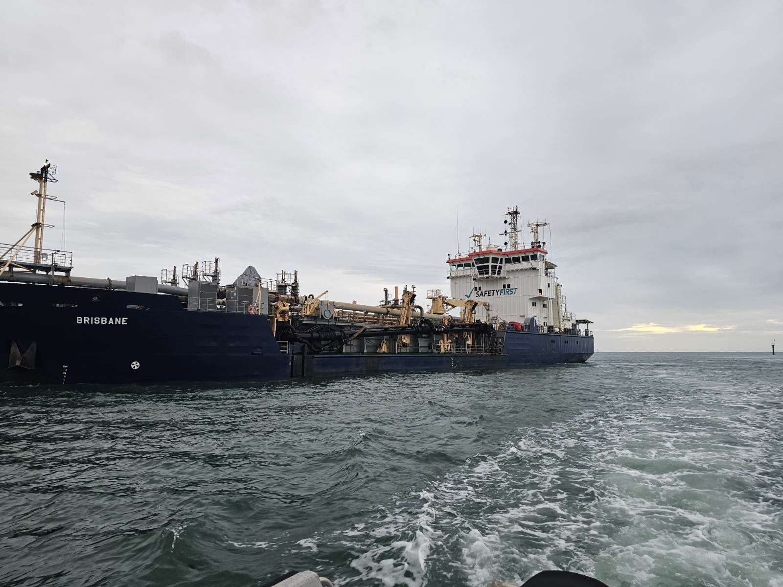 Man Using Laptop, Inspecting Electrical Control Panel — Projected Contracting Electrical Services In Port Douglas, QLD