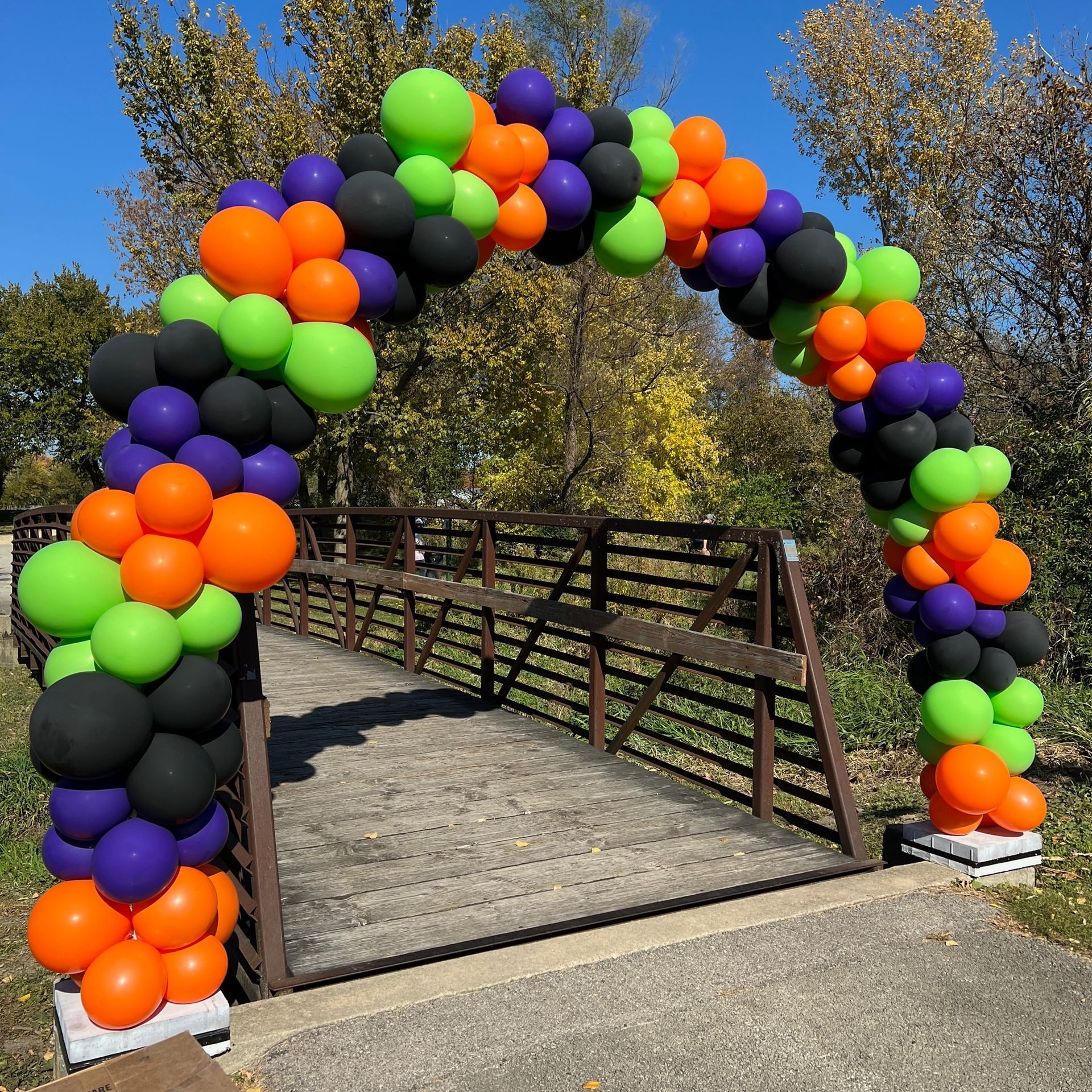 A bridge is decorated with balloons for halloween