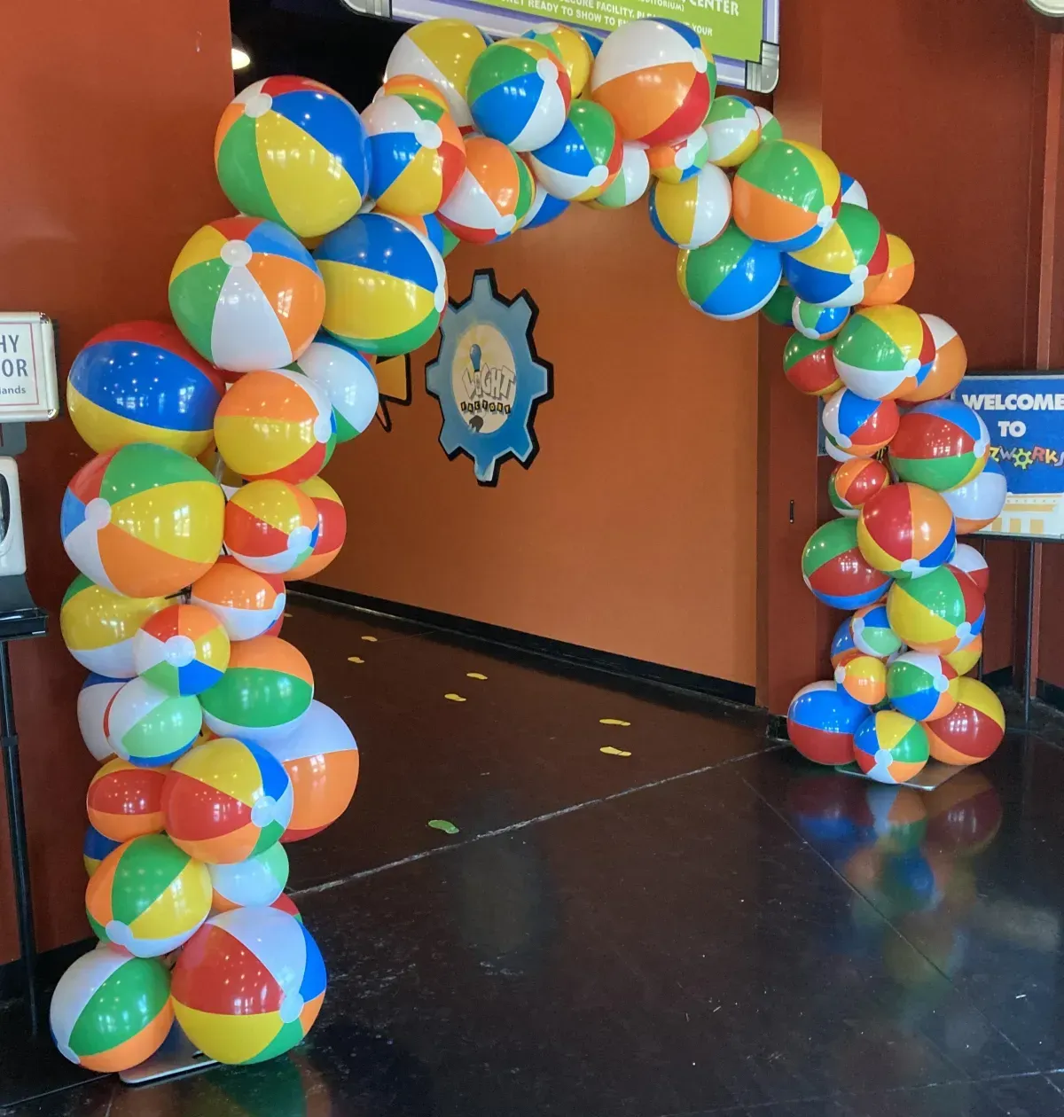 A bunch of beach balls are stacked on top of each other