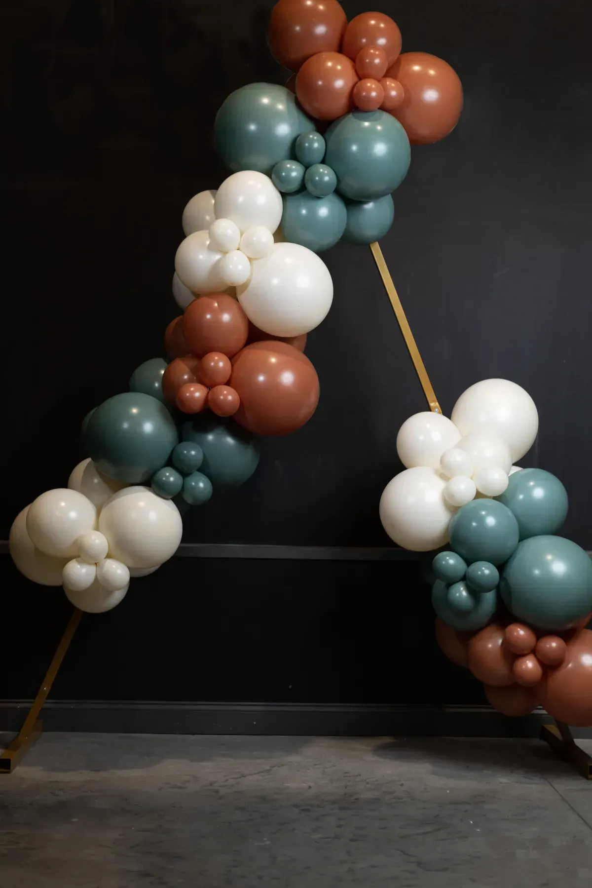 A bunch of balloons are stacked on top of each other in a room.