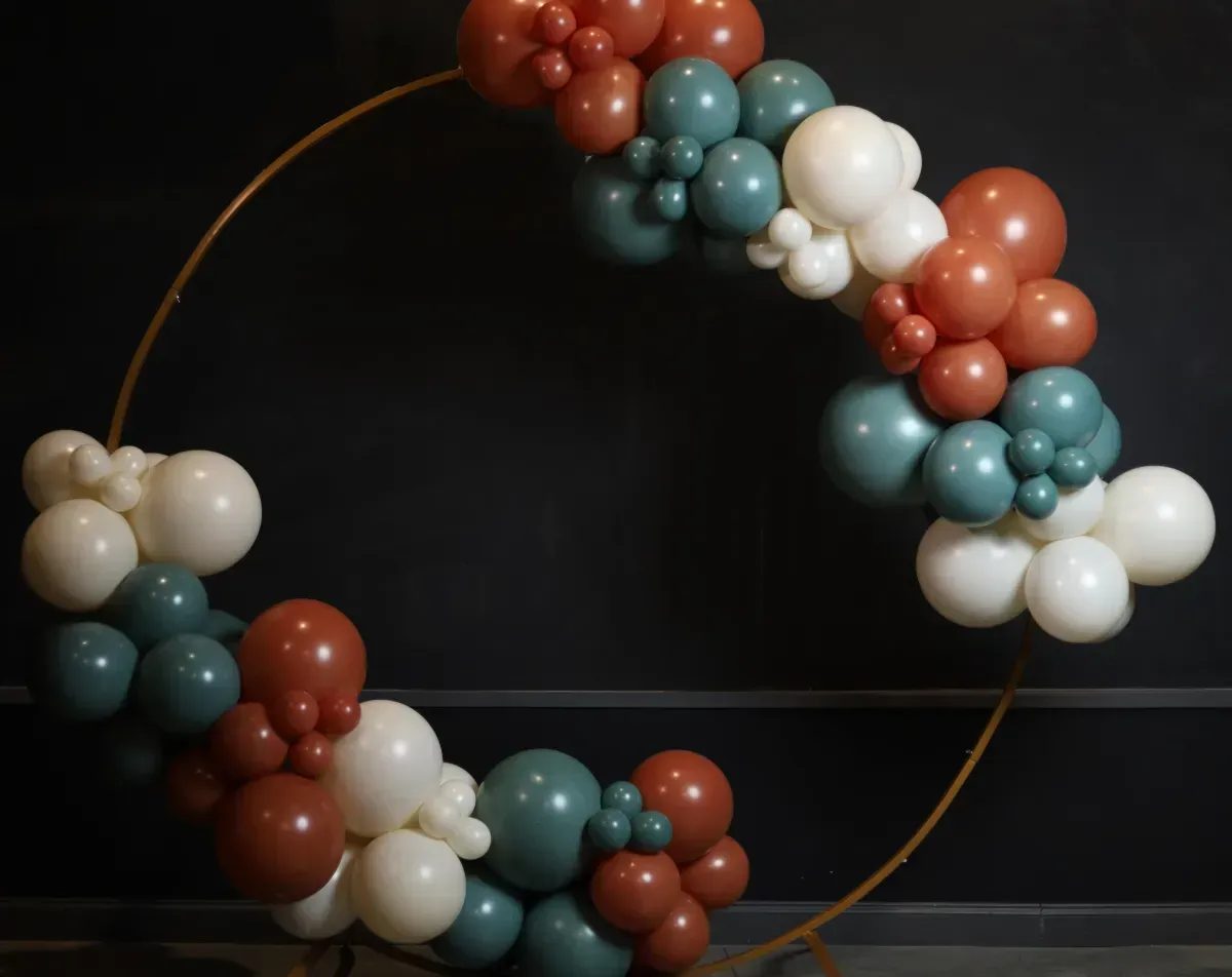 A circle made of balloons is sitting on a table.