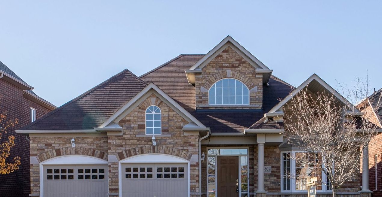 A person is typing on a laptop computer.