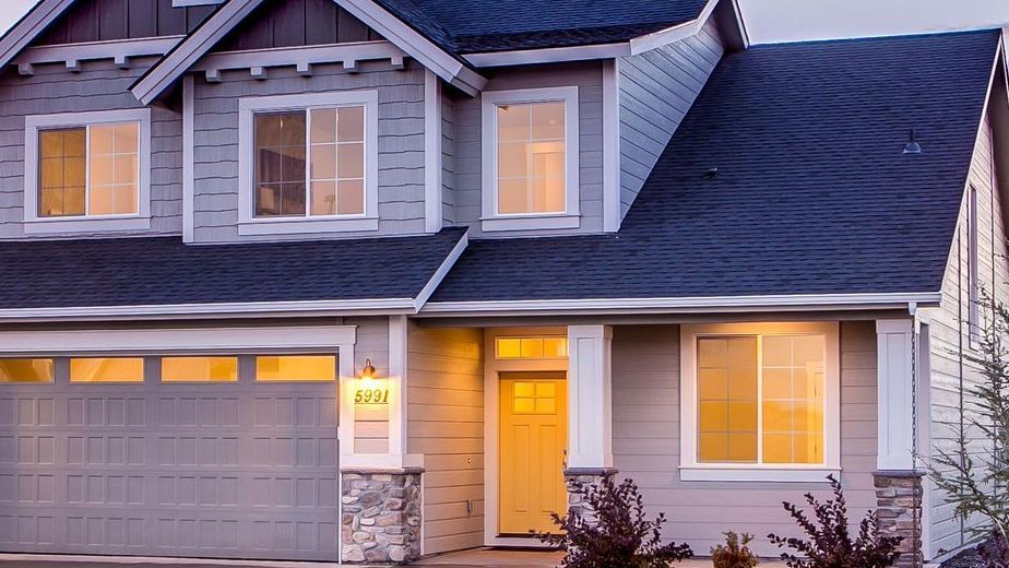 An empty room with a lot of windows and radiators
