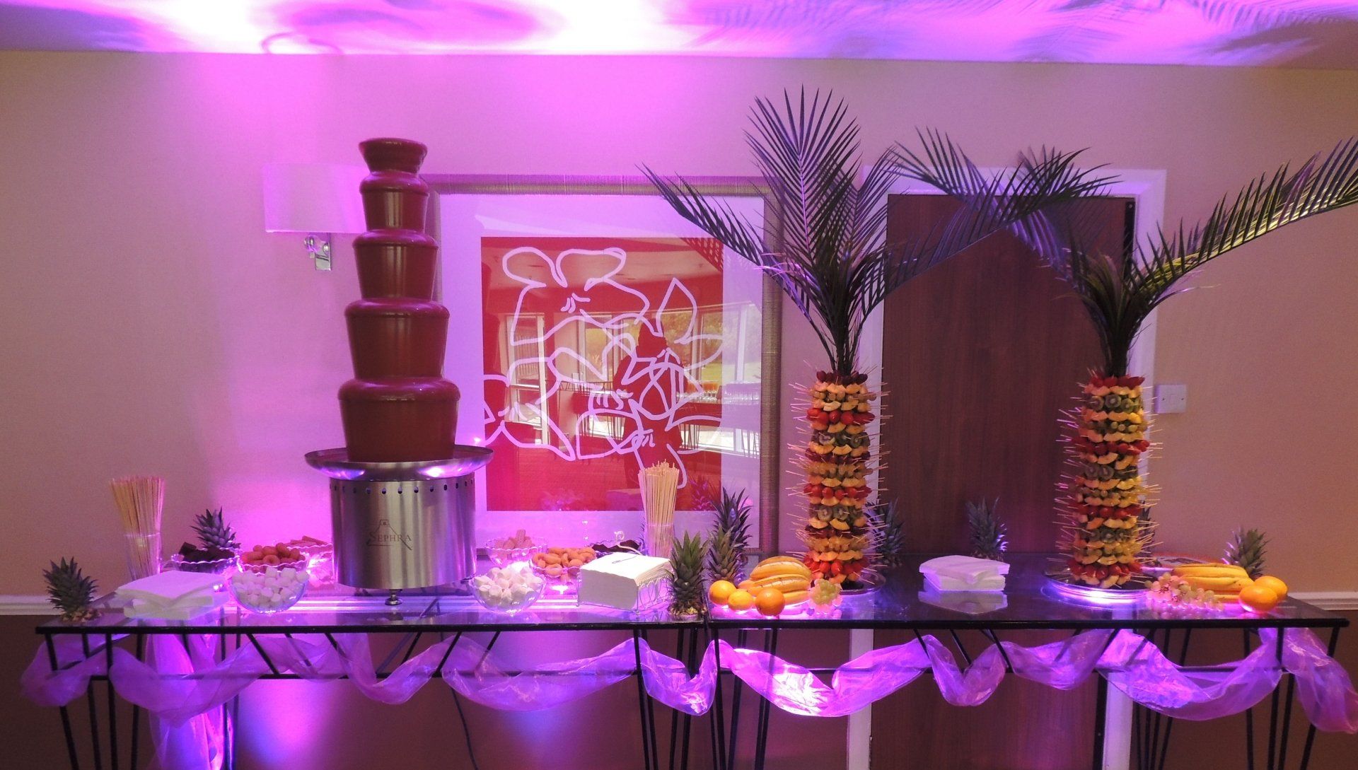 fruits display and chocolate fountain