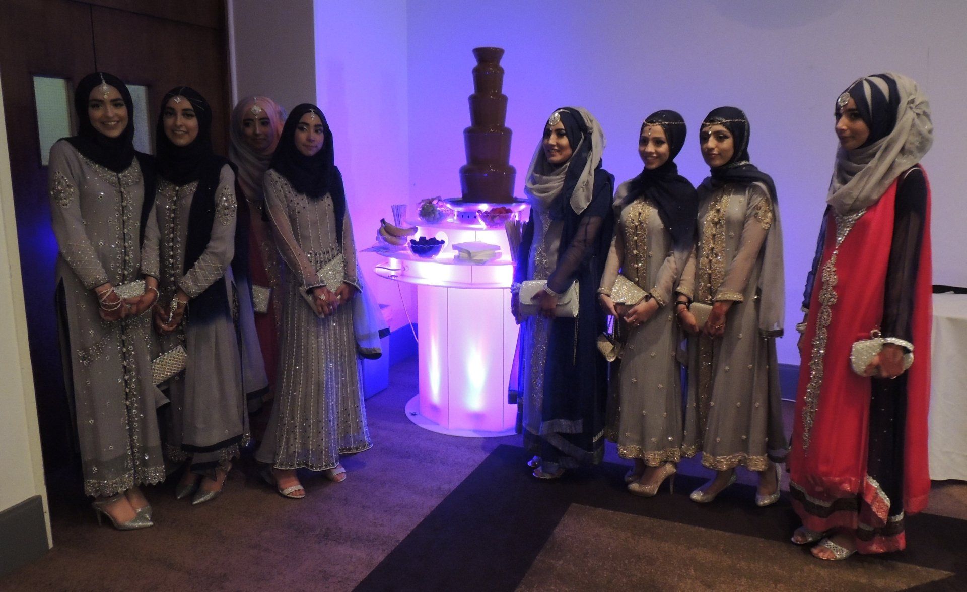 Ladies standing near the chocolate fountain