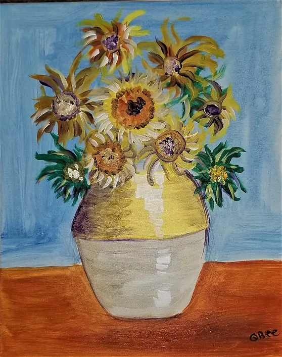 Sunflowers in a yellow vase, on an orange surface, against a blue background.