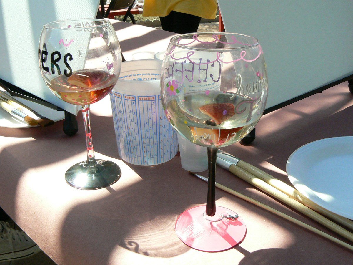 Two wine glasses, one with 