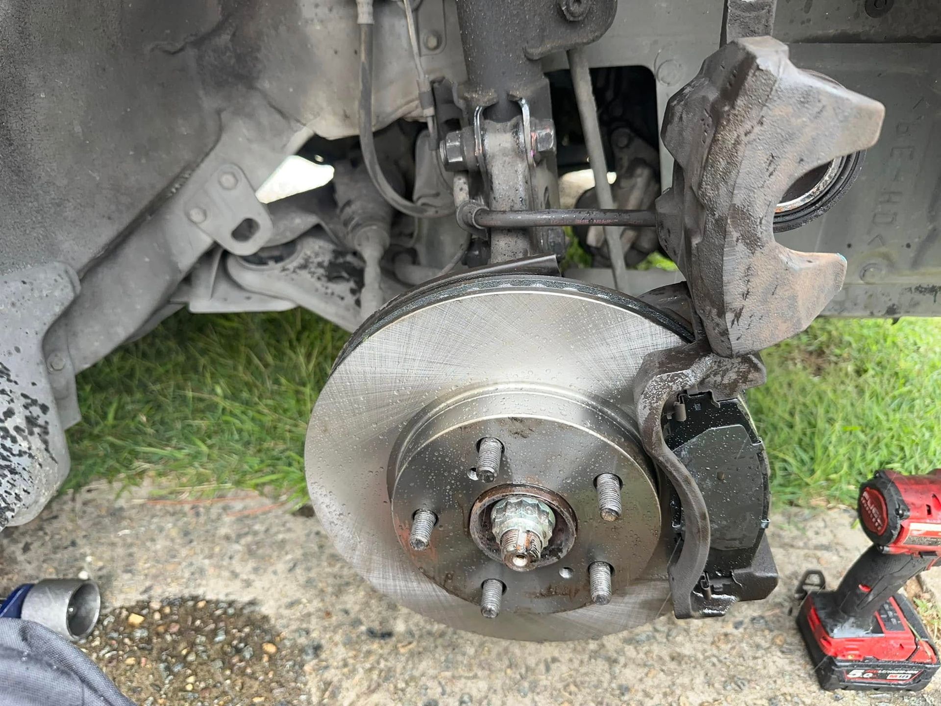 Car's Front Wheel Suspension Disassembled; Brake Rotor Visible — JDM Mobile Mechanical in Holsworthy, NSW
