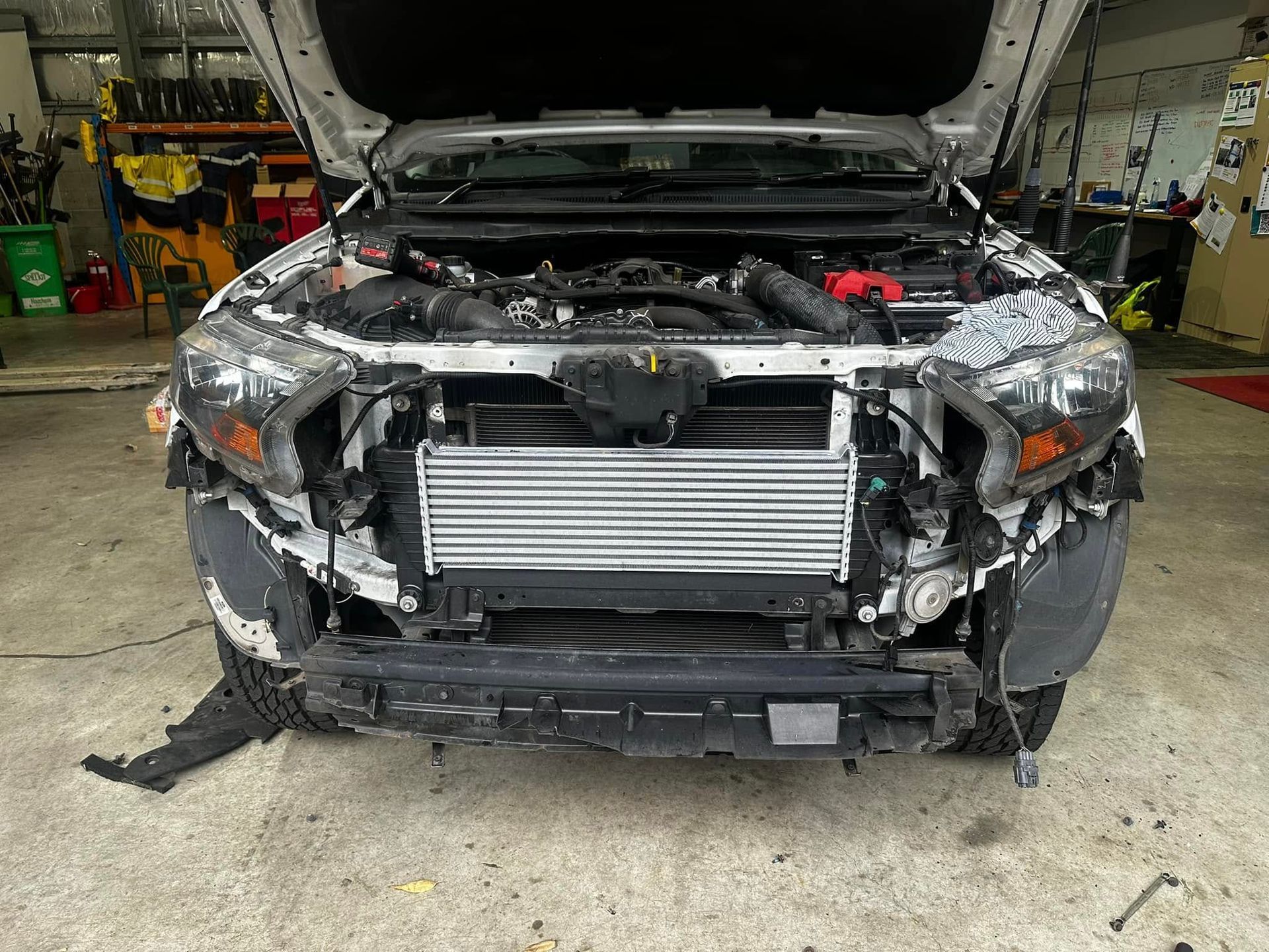 White Truck With Open Hood, Damaged Front Bumper — JDM Mobile Mechanical in Holsworthy, NSW