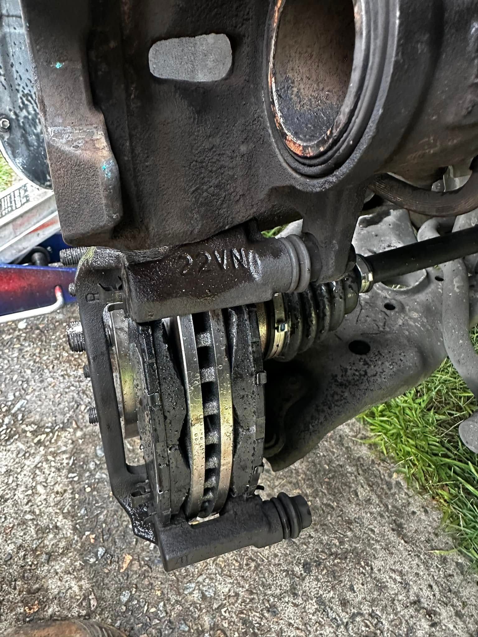 Car Brake Caliper, Rotor, and Pads. Black and Silver Components — JDM Mobile Mechanical in Moorebank, NSW