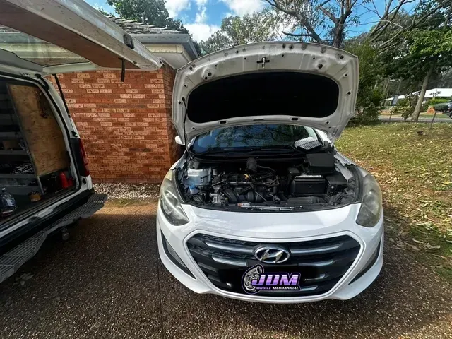White Car With Hood Open, Parked in a Yard Next to a Van — JDM Mobile Mechanical in Holsworthy, NSW