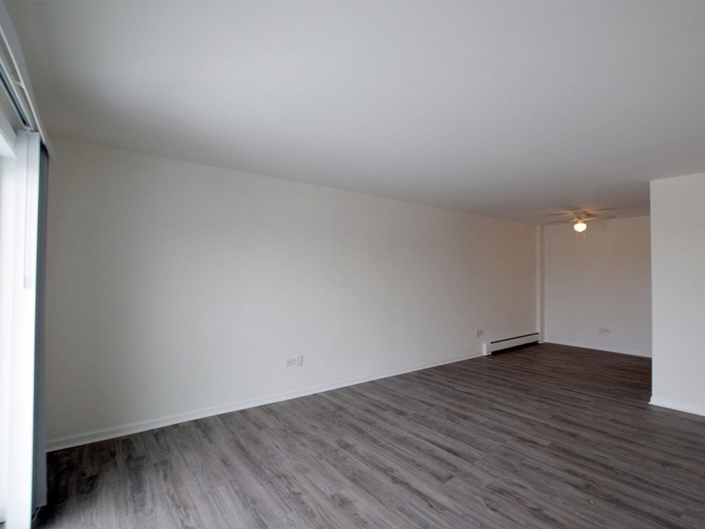 Living Room with flooring and white walls