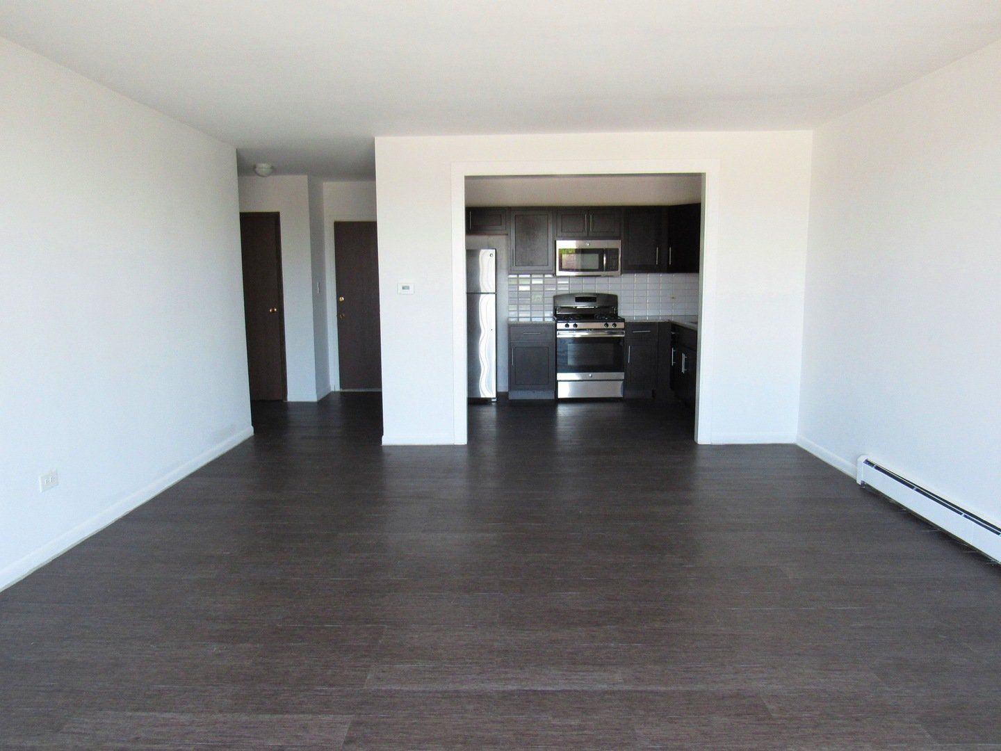 Interior of dining area with view of hallway and kitchen