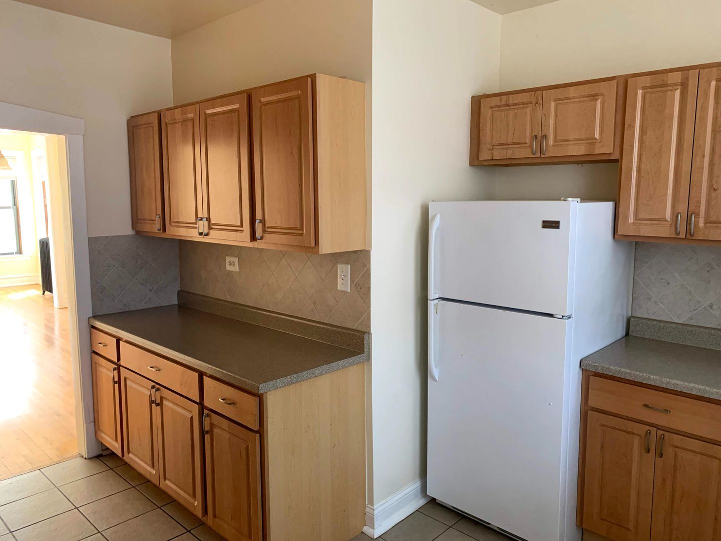 Alternate view of kitchen with white appliances
