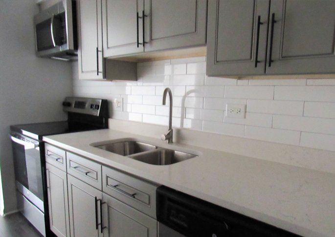 Kitchen with wood cabinetry and stainless steel appliances