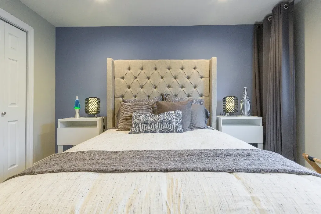 Bedroom with dark blue grey walls