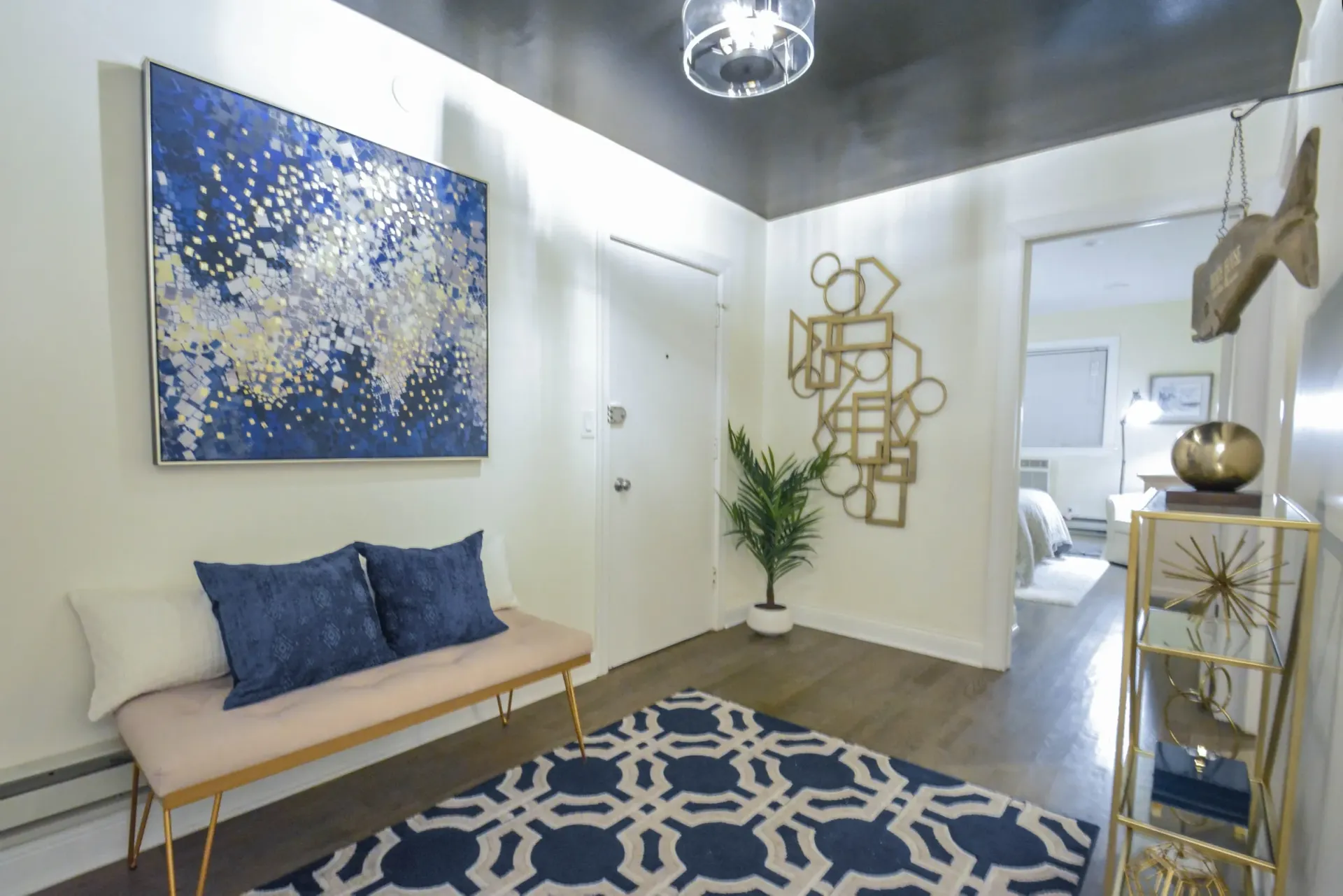 Interior entryway with chandelier and wall decoration